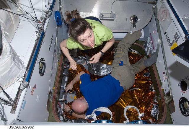NASA image: Kelly and Coleman prepare for HTV2 relocation