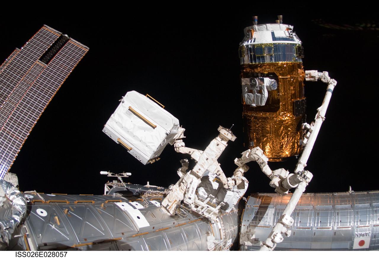 ISS026-E-028057 (18 Feb. 2011) --- In the grasp of the International Space Station?s Canadarm2, the Japanese Kounotori2 H-II Transfer Vehicle (HTV2) is relocated from the Harmony node nadir port to Harmony?s zenith port. NASA astronaut Catherine (Cady) Coleman and European Space Agency astronaut Paolo Nespoli, both Expedition 26 flight engineers, moved the HTV2, operating the station?s robotic arm from the controls inside the Cupola. The Canadian-built Dextre, also known as the Special Purpose Dextrous Manipulator (SPDM), is visible at center.