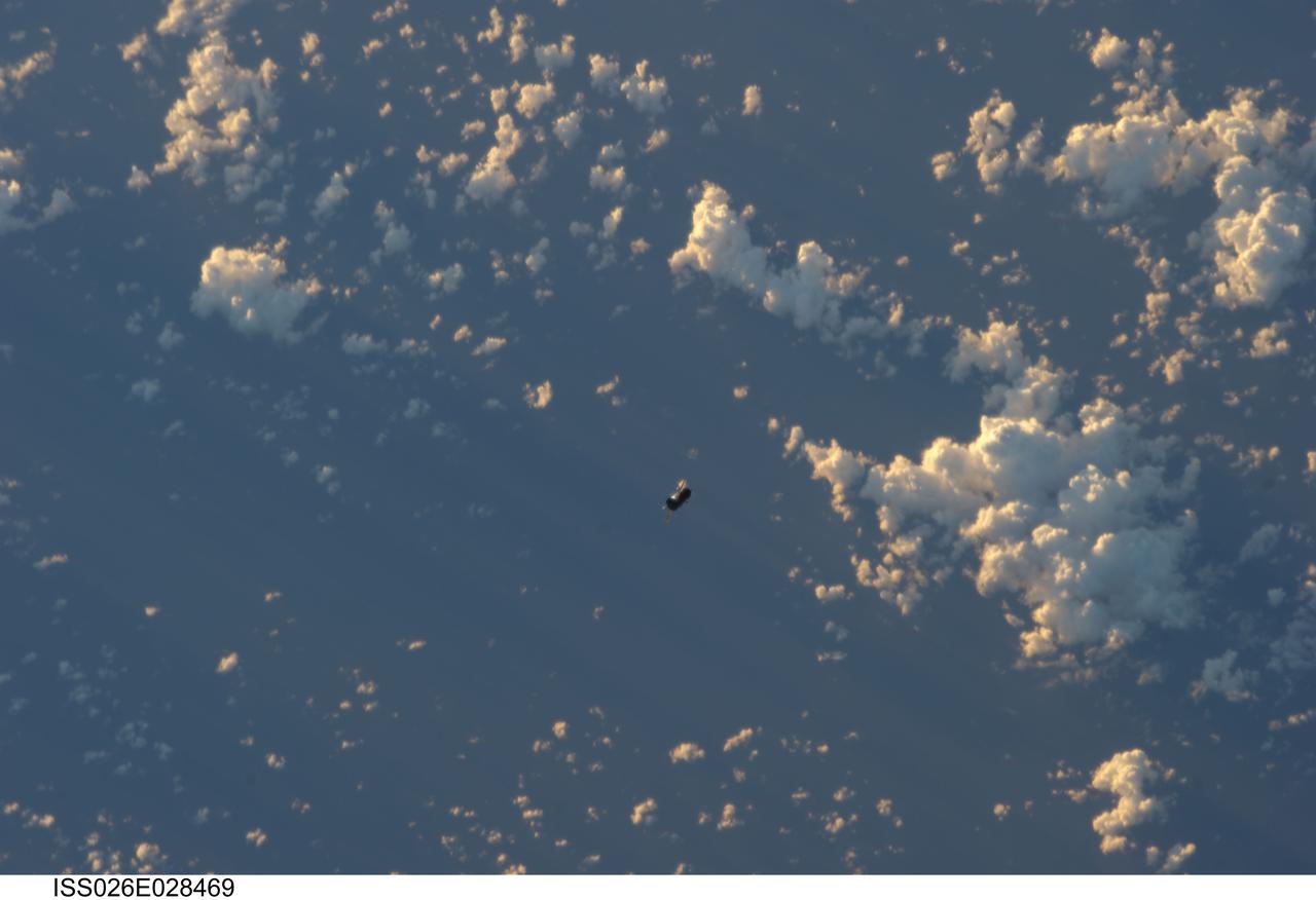 ISS026-E-028469 (20 Feb. 2011) --- Backdropped by a blue and white part of Earth, the unpiloted ISS Progress 39 supply vehicle appears to be very small as it departs from the International Space Station at 8:12 a.m. (EST) on Feb. 20, 2011. At 11:12 a.m., the deorbit burn braked the trash-loaded cargo ship into its re-entry trajectory over the Pacific Ocean, where it was burned up in Earth’s atmosphere.