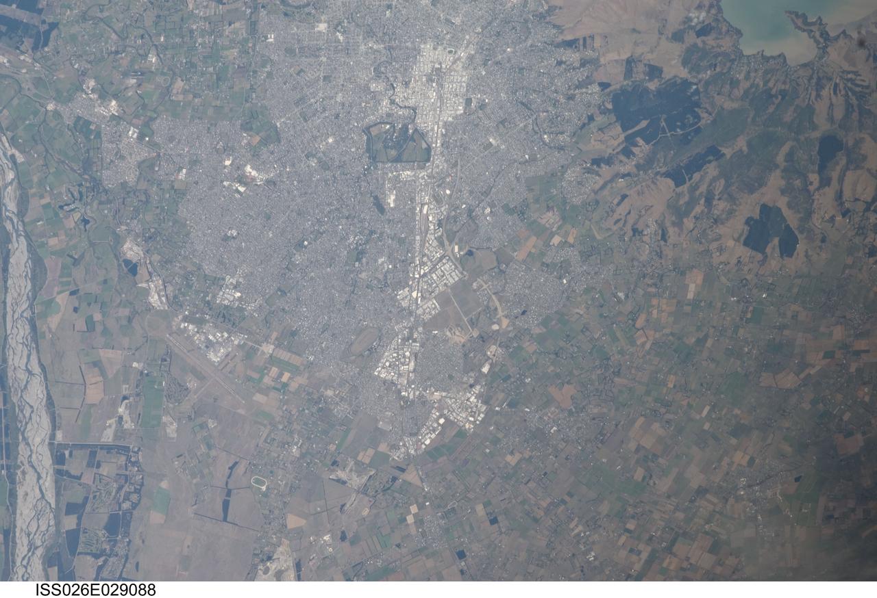 ISS026-E-029088  (24 Feb. 2011)   ---  From approximately 220 miles above Earth, an Expedition 26 crew member aboard the International Space Station exposed this still frame of parts of New Zealand including those impacted by an earthquake almost four days ago. This image shows portions of the city of Christchurch and includes a small area of the Banks Peninsula and Lyttelton Harbours.  Banks Peninsula is made up of two volcanoes -- Lyttelton and Akaroa. The boundaries of the city of Christchurch approach the slopes of the crater rim of the Lyttelton volcano