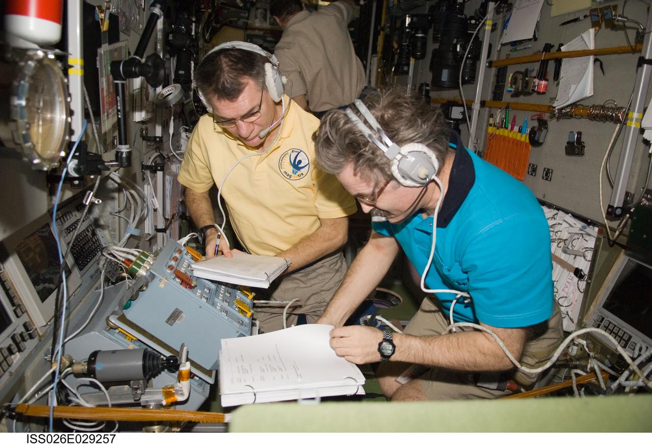 ISS026-E-029257 (24 Feb. 2011) --- European Space Agency astronaut Paolo Nespoli (left) and Russian cosmonaut Alexander Kaleri, both Expedition 26 flight engineers, monitor the approach and docking of the European Space Agency's "Johannes Kepler" Automated Transfer Vehicle-2 (ATV-2). The ATV2 automatically docked with the aft end of the International Space Station's Zvezda Service Module at 10:59 a.m. (EST) on Feb. 24, 2011.