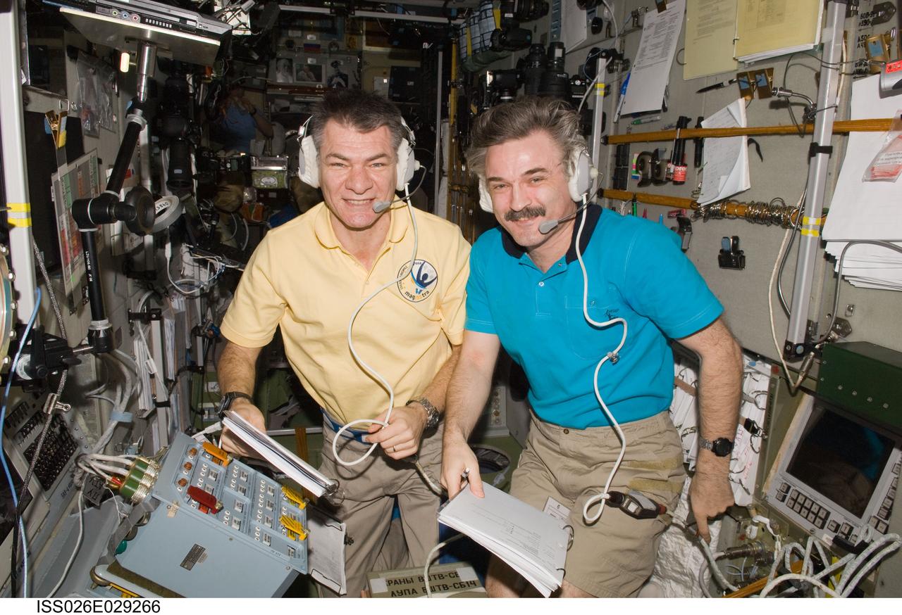 ISS026-E-029266 (24 Feb. 2011) --- European Space Agency astronaut Paolo Nespoli (left) and Russian cosmonaut Alexander Kaleri, both Expedition 26 flight engineers, monitor the approach and docking of the European Space Agency's "Johannes Kepler" Automated Transfer Vehicle-2 (ATV-2). The ATV2 automatically docked with the aft end of the International Space Station's Zvezda Service Module at 10:59 a.m. (EST) on Feb. 24, 2011.