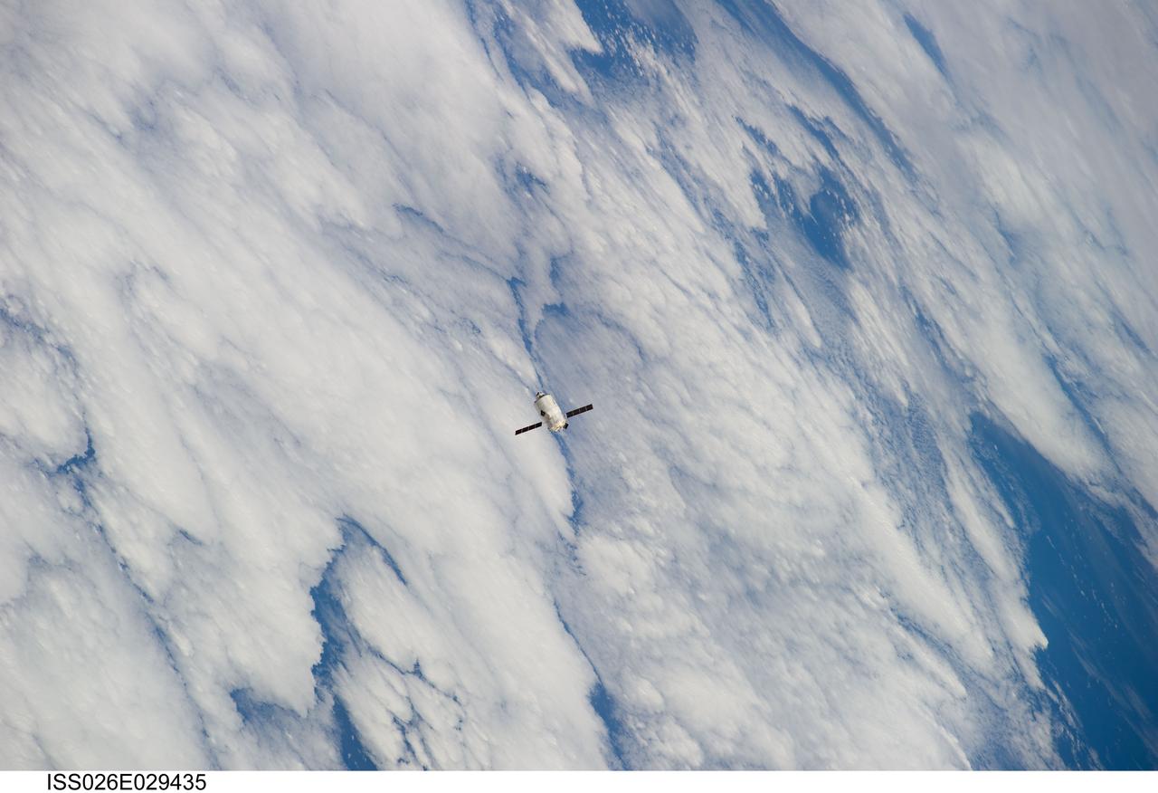 ISS026-E-029435 (24 Feb. 2011) --- Backdropped by a cloud-covered part of Earth, the European Space Agency's "Johannes Kepler" Automated Transfer Vehicle-2 (ATV-2) approaches the International Space Station. Docking of the two spacecraft occurred at 10:59 a.m. (EST) on Feb. 24, 2011.