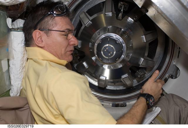 NASA image: Nespoli removes docking mechanism to the ATV Hatch