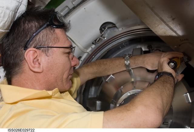 NASA image: Nespoli removes docking mechanism to the ATV Hatch