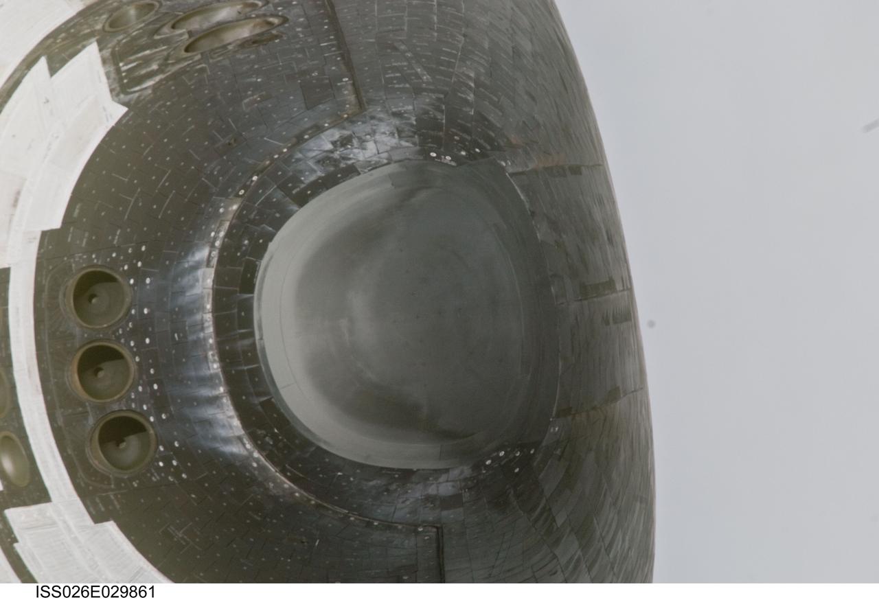 ISS026-E-029861 (26 Feb. 2011) --- This close-up view of the nose of space shuttle Discovery was provided by an Expedition 26 crew member during a survey of the approaching STS-133 vehicle prior to docking with the International Space Station. As part of the survey and part of every mission's activities, Discovery performed a back-flip for the rendezvous pitch maneuver (RPM). The station crew member used a digital still camera with an 800mm focal length, as the two spacecraft were approximately 600 feet (180 meters) apart.