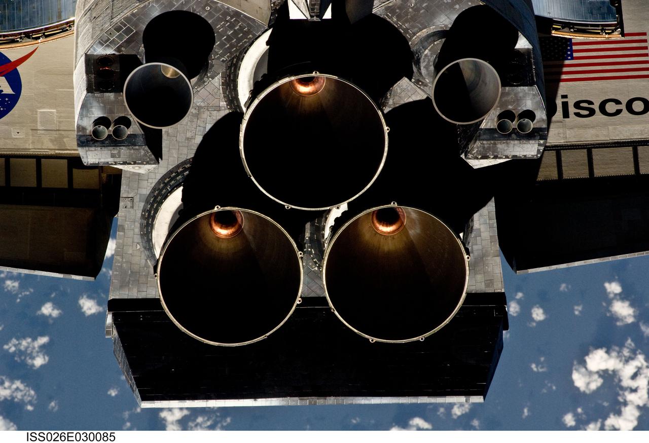 ISS026-E-030085 (26 Feb. 2011) --- This view of the aft portion of the space shuttle Discovery, including the three main engines and part of the wings, was provided by an Expedition 26 crew member during a survey of the approaching STS-133 vehicle prior to docking with the International Space Station. As part of the survey and part of every mission's activities, Discovery performed a back-flip for the rendezvous pitch maneuver (RPM). The image was photographed with a digital still camera, using a 400mm lens at a distance of about 600 feet (180 meters).