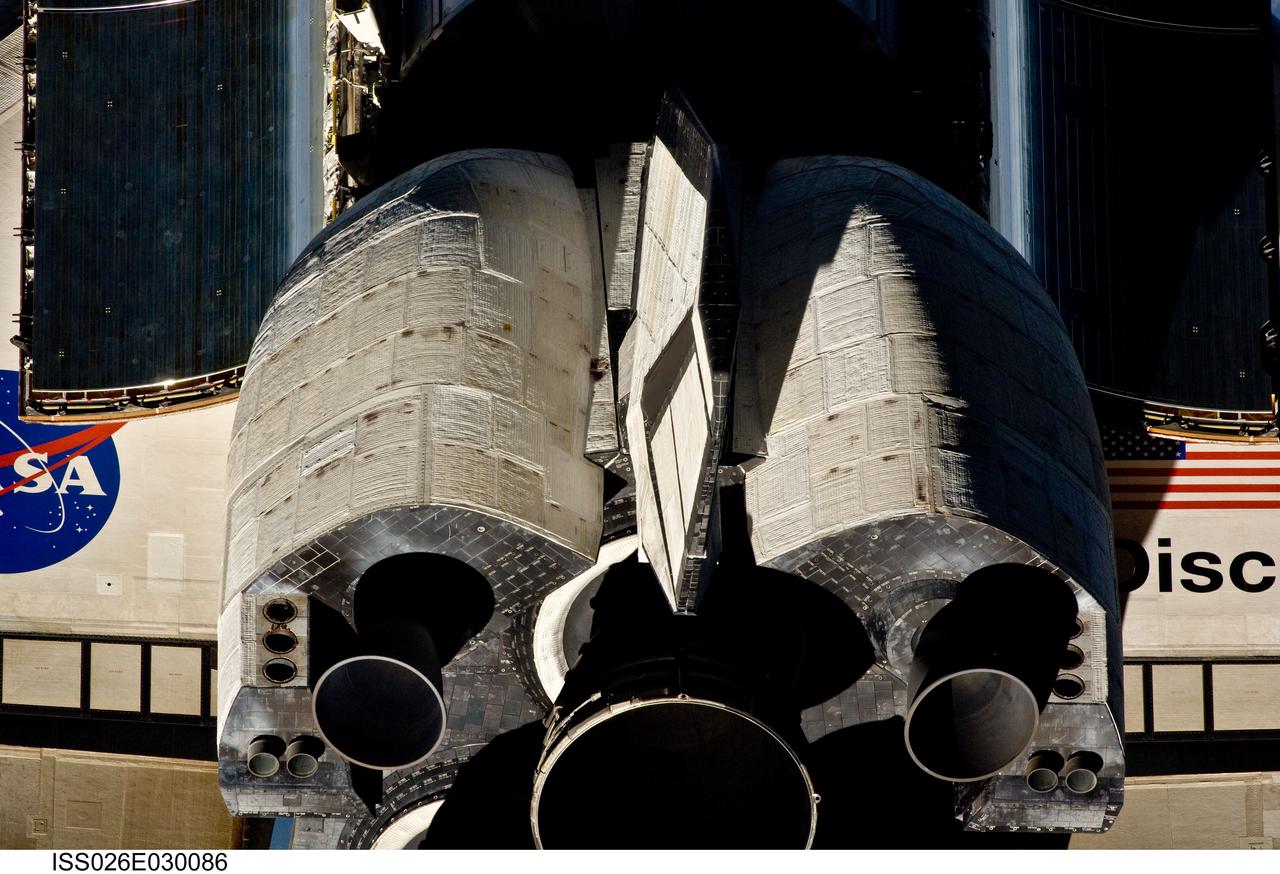 ISS026-E-030086 (26 Feb. 2011) --- This view of the aft portion of the space shuttle Discovery, including the three main engines and orbital maneuvering system (OMS) pods, was provided by an Expedition 26 crew member during a survey of the approaching STS-133 vehicle prior to docking with the International Space Station. As part of the survey and part of every mission's activities, Discovery performed a back-flip for the rendezvous pitch maneuver (RPM). The image was photographed with a digital still camera, using a 400mm lens at a distance of about 600 feet (180 meters).