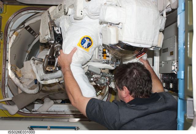 NASA image: Barratt assists Drew with EMU