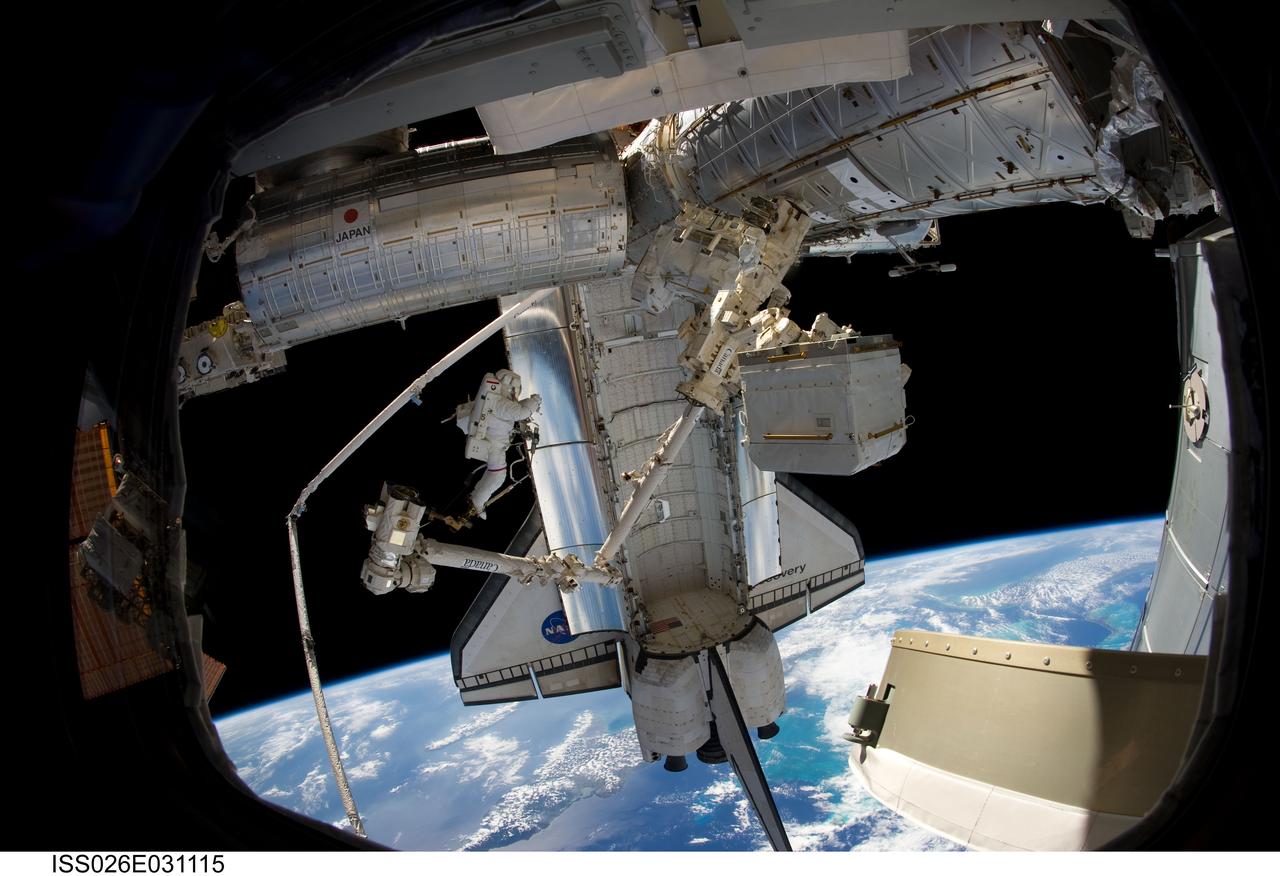 ISS026-E-031115 (2 March 2011) --- Anchored to a Canadarm2 mobile foot restraint, NASA astronaut Steve Bowen, STS-133 mission specialist, participates in the mission?s second session of extravehicular activity (EVA) as construction and maintenance continue on the International Space Station. During the six-hour, 14-minute spacewalk, Bowen and astronaut Alvin Drew (out of frame), mission specialist, tackled a variety of tasks, including venting into space some remaining ammonia from a failed pump module they moved during the mission?s first spacewalk. Photo credit: NASA or National Aeronautics and Space Administration