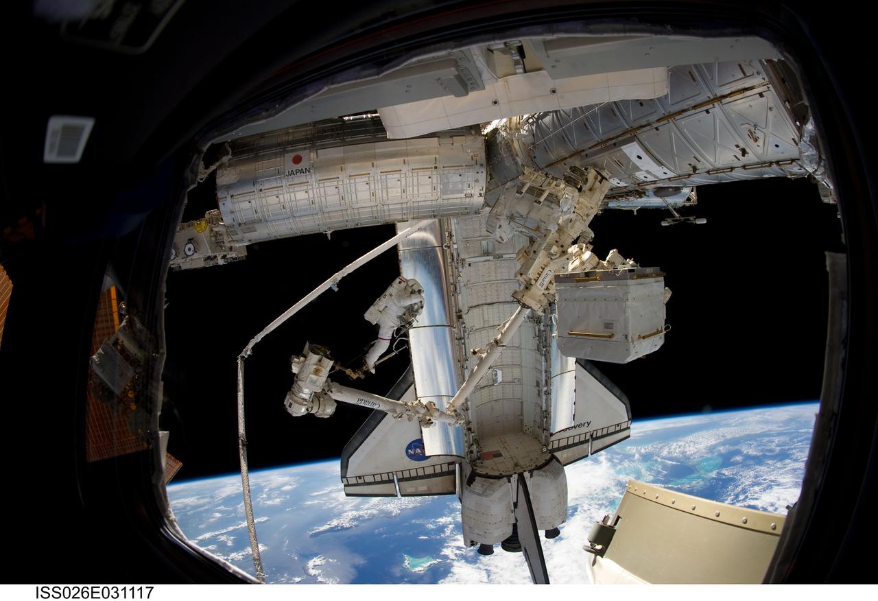 ISS026-E-031117 (2 March 2011) --- Anchored to a Canadarm2 mobile foot restraint, NASA astronaut Steve Bowen, STS-133 mission specialist, participates in the mission?s second session of extravehicular activity (EVA) as construction and maintenance continue on the International Space Station. During the six-hour, 14-minute spacewalk, Bowen and astronaut Alvin Drew (out of frame), mission specialist, tackled a variety of tasks, including venting into space some remaining ammonia from a failed pump module they moved during the mission?s first spacewalk. Photo credit: NASA or National Aeronautics and Space Administration