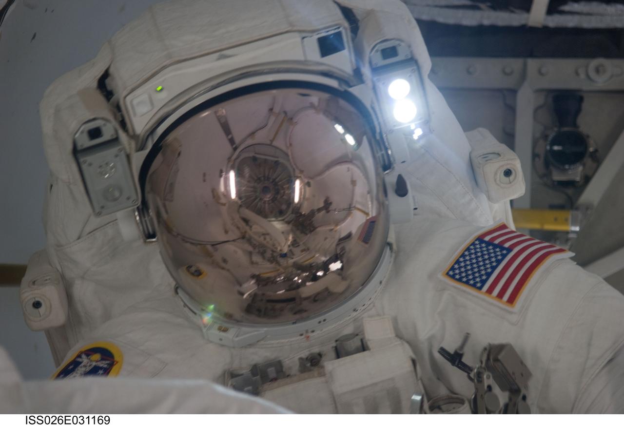 ISS026-E-031169 (28 Feb. 2011) --- Attired in his Extravehicular Mobility Unit (EMU) spacesuit, NASA astronaut Alvin Drew, STS-133 mission specialist, is pictured in the International Space Station?s Quest airlock as the mission?s first spacewalk draws to a close.