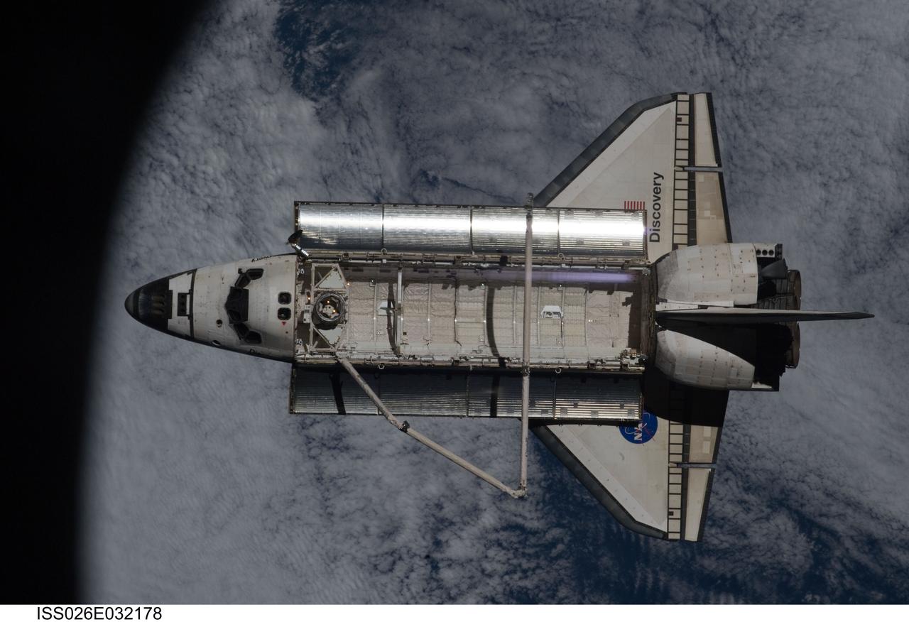 ISS026-E-032178 (7 March 2011) --- The space shuttle Discovery is seen from the International Space Station as the two orbital spacecraft accomplish their relative separation on March 7 after an aggregate of 12 astronauts and cosmonauts worked together for over a week. During a post undocking fly-around, the crew members aboard the two spacecraft collected a series of photos of each other’s vehicle.