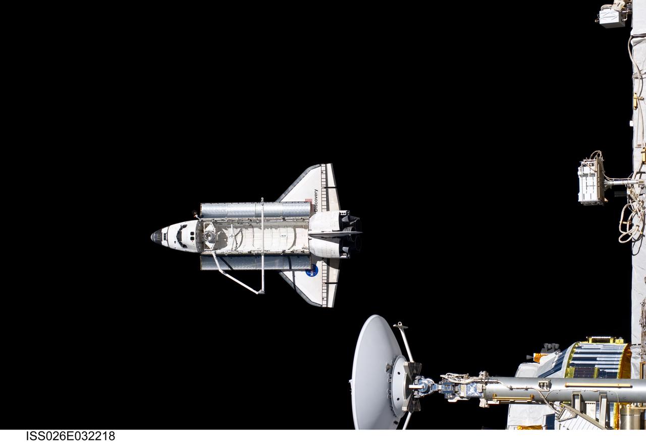 ISS026-E-032218 (7 March 2011) ---  Backdropped against the blackness of space,  Discovery is seen from the International Space Station as the two orbital spacecraft accomplish their relative separation on March 7 after an aggregate of 12 astronauts and cosmonauts worked together for over a week.  During a post undocking fly-around, the crew members aboard the two spacecraft collected a series of photos of each other’s vehicle.