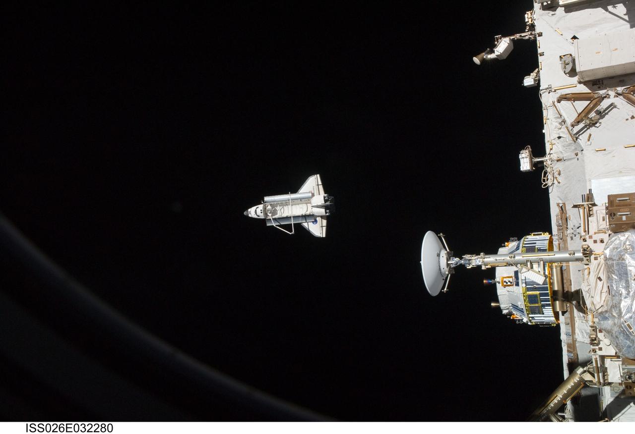 ISS026-E-032280 (7 March 2011) --- The space shuttle Discovery is seen from the International Space Station as the two orbital spacecraft accomplish their relative separation on March 7 after an aggregate of 12 astronauts and cosmonauts worked together for over a week. During a post undocking fly-around, the crew members aboard the two spacecraft collected a series of photos of each other’s vehicle.