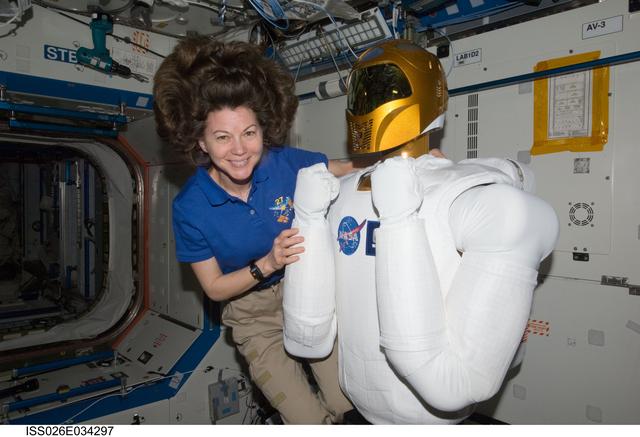 NASA image: Coleman poses with Robonaut 2