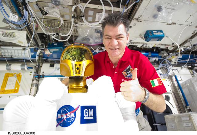 NASA image: Nespoli poses with Robonaut 2