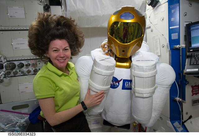 NASA image: Coleman poses with Robonaut 2 in the U.S. Laboratory