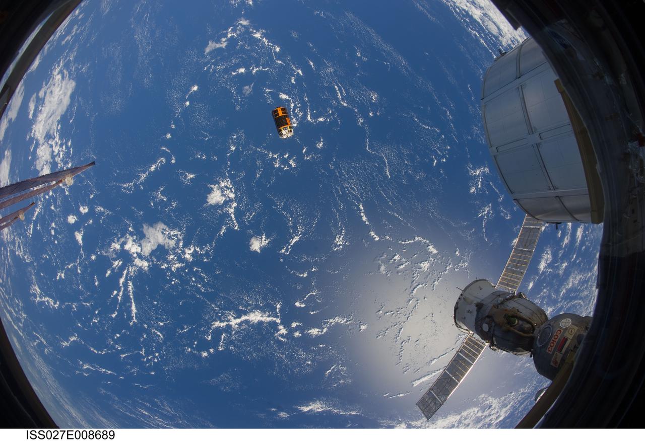 ISS027-E-008689 (28 March 2011) --- A fish-eye lens attached to an electronic still camera was used to capture this image of the unpiloted Japan Aerospace Exploration Agency?s Kounotori2 H-II Transfer Vehicle (HTV2), filled with trash and unneeded items, as it departs from the International Space Station. NASA astronaut Cady Coleman and European Space Agency astronaut Paolo Nespoli, both Expedition 27 flight engineers, used the station?s robot arm to grapple the HTV2 and unberth it from the Earth-facing port of the Harmony node. The cargo craft was released at 11:46 a.m. (EDT) on March 28, 2011.