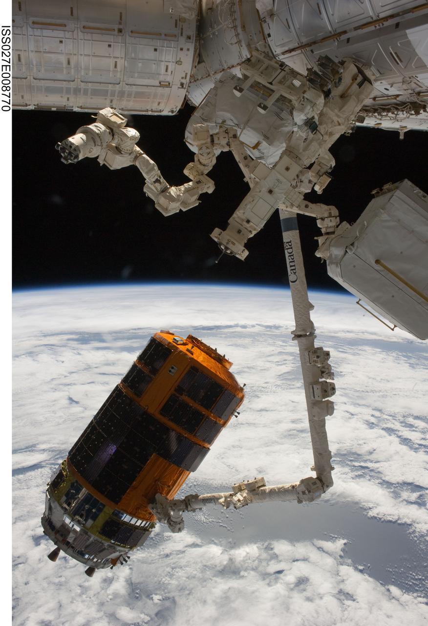 ISS027-E-008770 (28 March 2011) --- Backdropped by Earth?s horizon and the blackness of space, the International Space Station's Canadarm2 unberths the unpiloted Japan Aerospace Exploration Agency?s Kounotori2 H-II Transfer Vehicle (HTV2), filled with trash and unneeded items, in preparation for its release from the station. NASA astronaut Cady Coleman and European Space Agency astronaut Paolo Nespoli, both Expedition 27 flight engineers, used the station?s robot arm to grapple the HTV2 and unberth it from the Earth-facing port of the Harmony node. The cargo craft was released at 11:46 a.m. (EDT) on March 28, 2011.