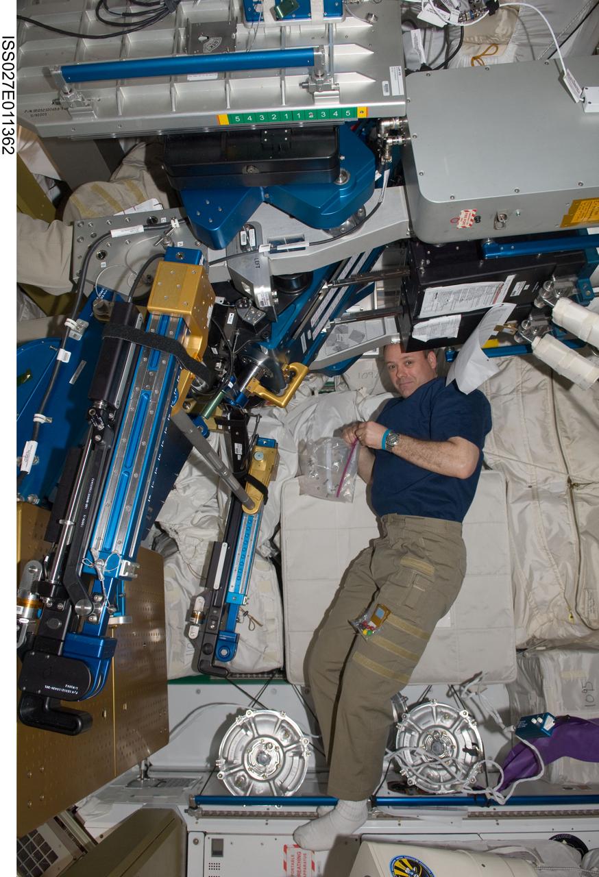 ISS027-E-011362 (10 April 2011) --- NASA astronaut Ron Garan, Expedition 27 flight engineer, works on the advanced Resistive Exercise Device (aRED) in the Tranquility node of the International Space Station.