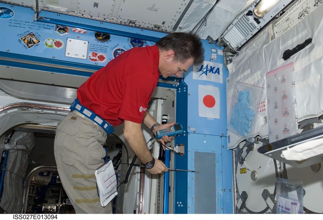 ISS027-E-013094 (14 April 2011) --- European Space Agency astronaut Paolo Nespoli, Expedition 27 flight engineer, uses a portable ventilation test instrument to take intermodular ventilation (IMV) flow measurements in the Kibo laboratory of the International Space Station.