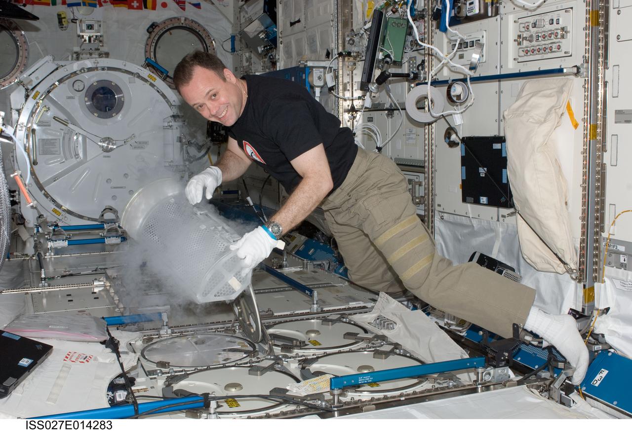 iss027e014283 (4/13/2011) --- Expedition 27 flight engineer Ron Garan prepares to stow a blood draw for the CSA (Canadian Space Agency) Vascular Blood Collection protocol in the Minus Eighty Laboratory Freezer for ISS (MELFI-1) in the Kibo laboratory of the International Space Station.
