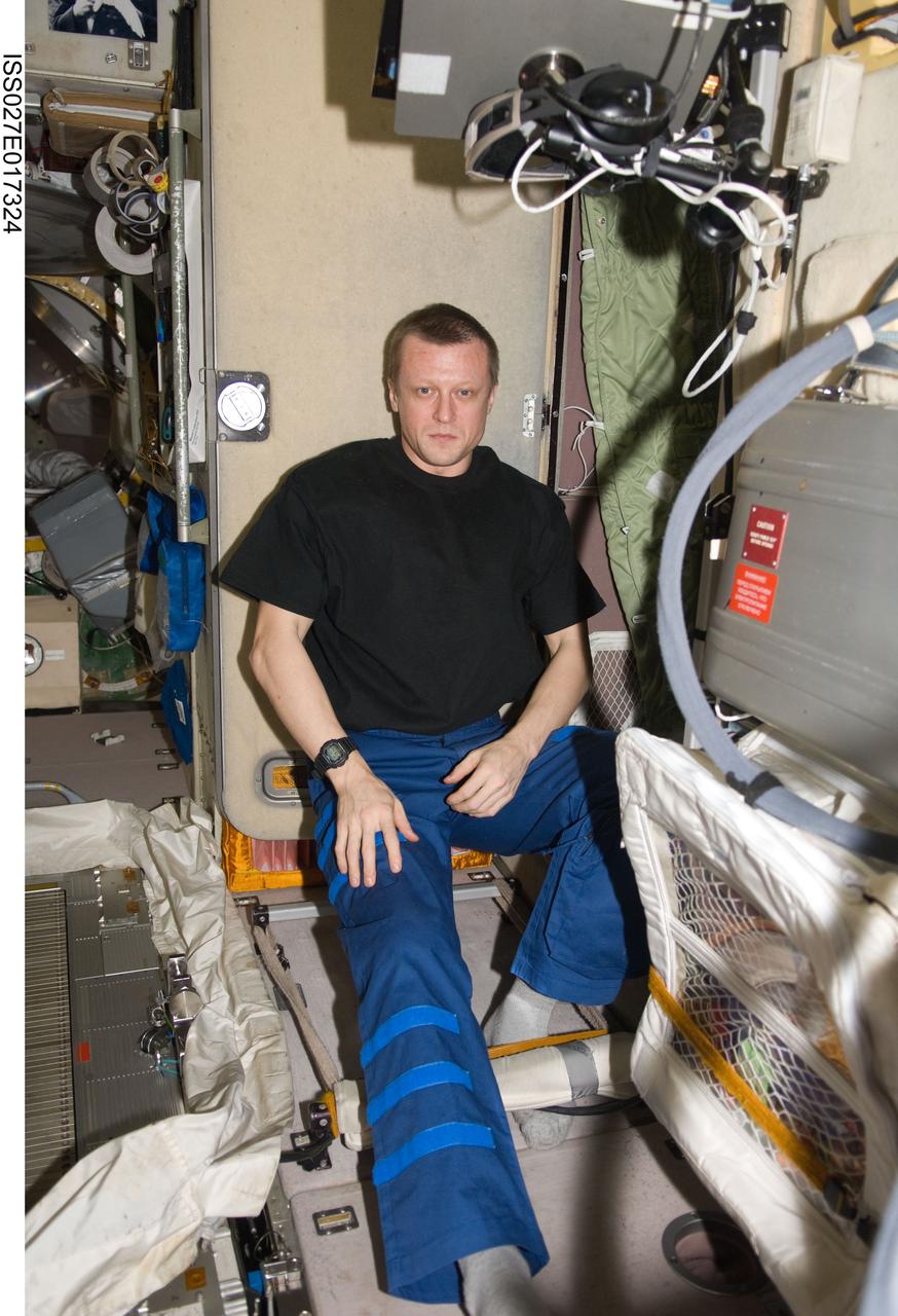 ISS027-E-017324 (27 April 2011) --- Russian cosmonaut Dmitry Kondratyev, Expedition 27 commander, is pictured in the Zvezda Service Module of the International Space Station.