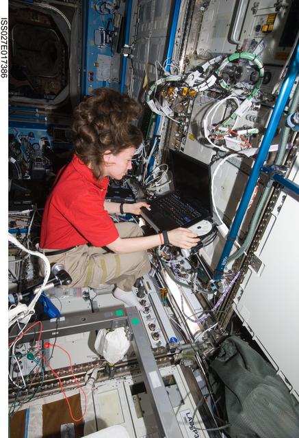 NASA image: Coleman works with AMS Laptop in the US Lab
