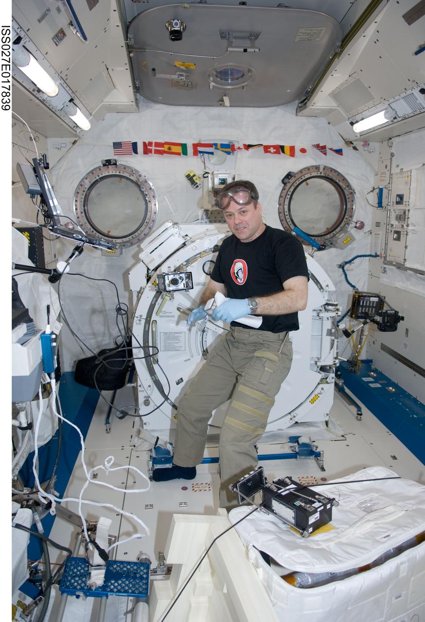 ISS027-E-017839 (28 April 2011) --- NASA astronaut Ron Garan, Expedition 27 flight engineer, supports the Dynamism of Auxin Efflux Facilitators responsible for Gravity-regulated Growth and Development in Cucumber (CsPINs) experiment in the Kibo laboratory of the International Space Station. CsPINs studies the phenomenon of tropism, i.e., the growth or turning movement of a biological organism, usually a plant, in response to an environmental stimulus. Specifically focusing on gravity, the new JAXA life science experiment investigates how plants sense gravity as an environmental signal and use it for governing their morphology and growth orientation.