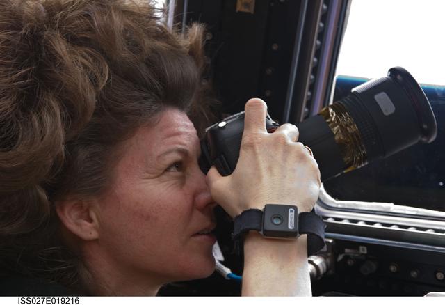 NASA image: Coleman uses a Camera at a Cupola Window