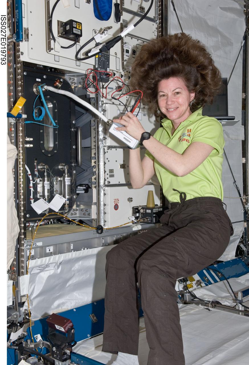 ISS027-E-019793 (2 May 2011) --- NASA astronaut Cady Coleman, Expedition 27 flight engineer, performs in-flight maintenance (IFM) on the Gradient Heating Furnace (GHF) on the Kobairo Rack in the Kibo laboratory of the International Space Station.