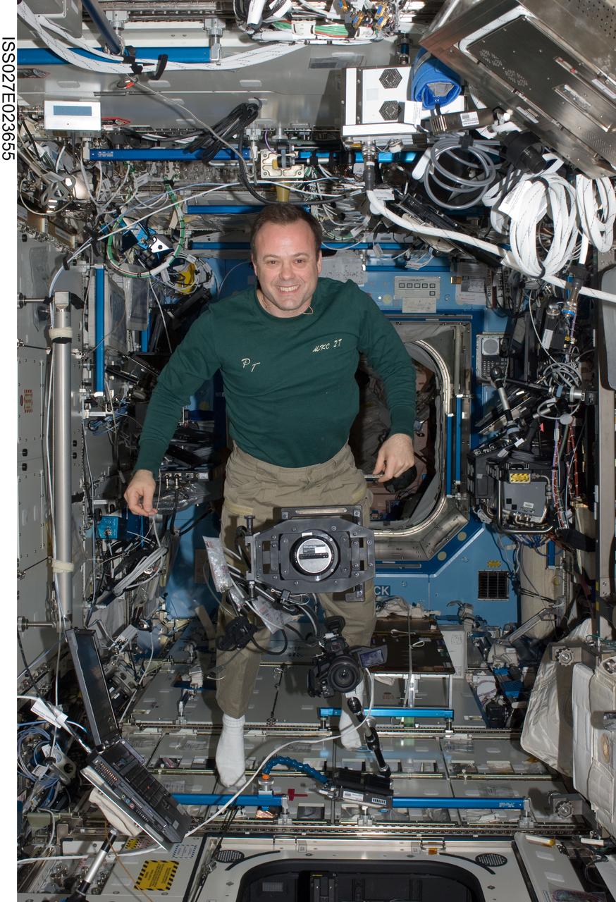 ISS027-E-023655 (6 May 2011) --- NASA astronaut Ron Garan, Expedition 27 flight engineer, works with ISS Agricultural Camera (ISSAC) hardware in the Destiny laboratory of the International Space Station. ISSAC, a successor of the earlier AgCam, will operate in conjunction with EarthKAM, both instruments to conduct simultaneous but independent operations in the WORF rack in Destiny.