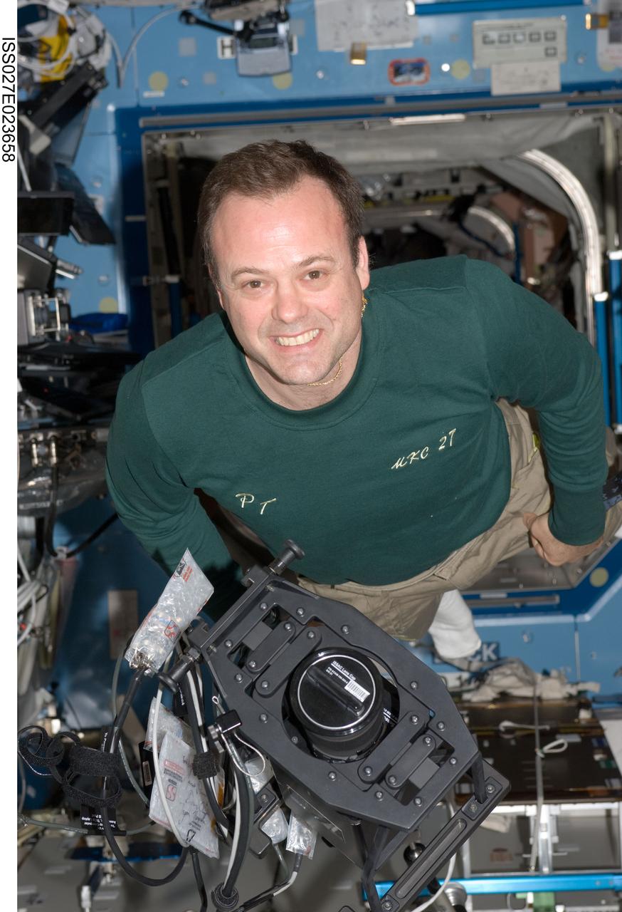 ISS027-E-023658 (6 May 2011) --- NASA astronaut Ron Garan, Expedition 27 flight engineer, works with ISS Agricultural Camera (ISSAC) hardware in the Destiny laboratory of the International Space Station. ISSAC, a successor of the earlier AgCam, will operate in conjunction with EarthKAM, both instruments to conduct simultaneous but independent operations in the WORF rack in Destiny.