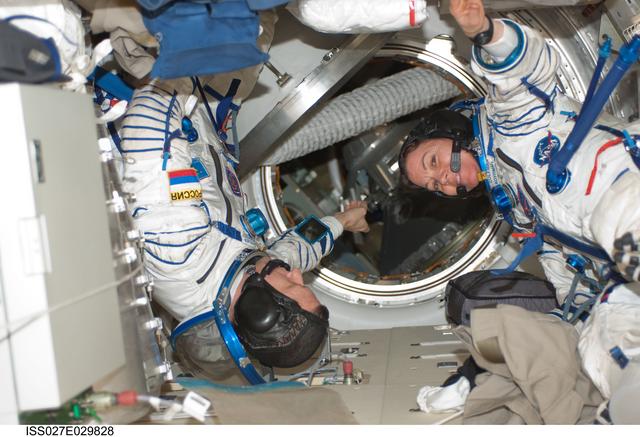 NASA image: Kondratyev and Coleman during Sokol Leak Check