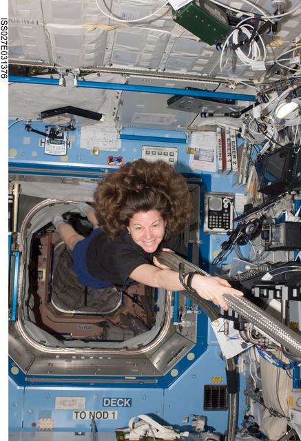 NASA image: Coleman poses with the MCA VAJ in the US Lab