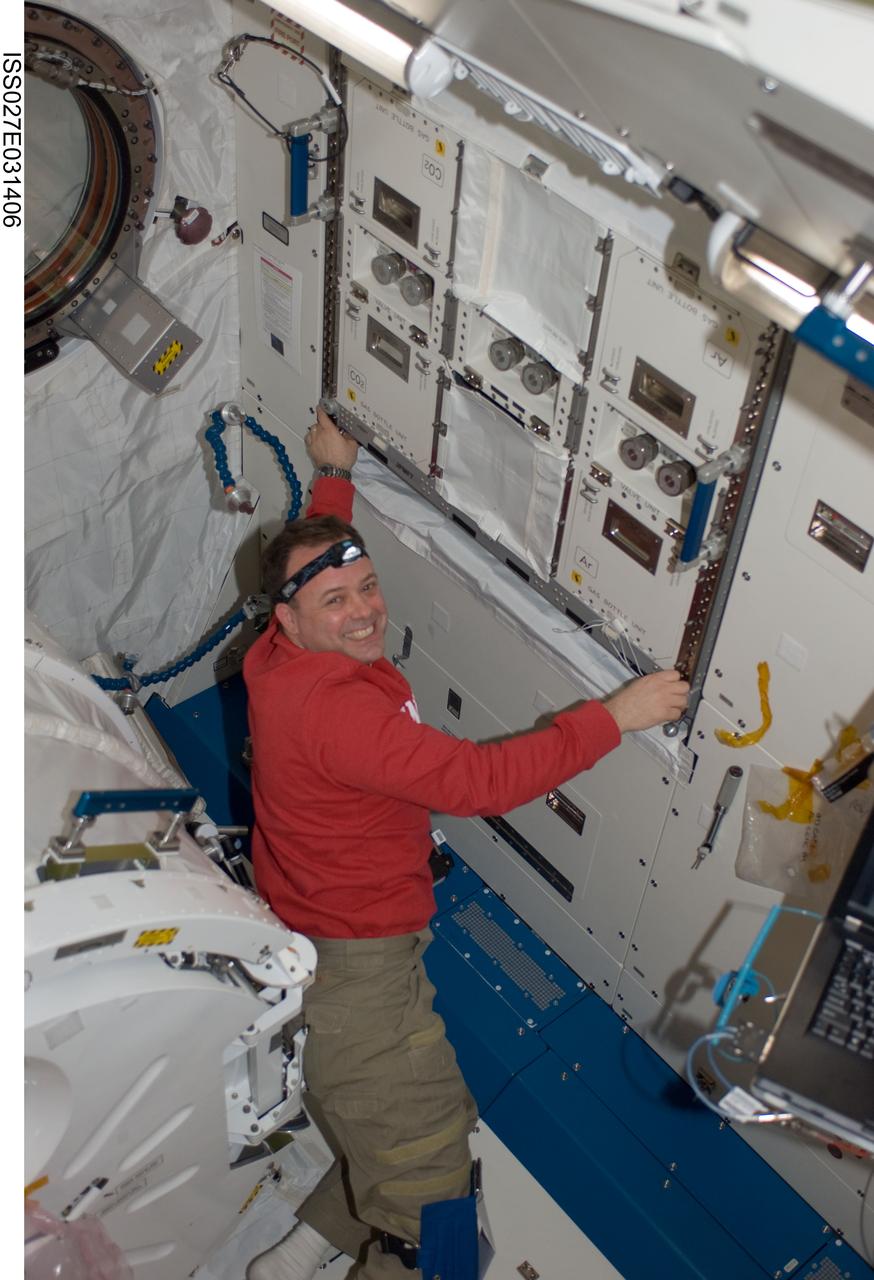 ISS027-E-031406 (16 May 2011) --- NASA astronaut Ron Garan, Expedition 27 flight engineer, installs a helium valve unit at the Common Gas Supply Equipment (CGSE) rack in the Kibo laboratory of the International Space Station.