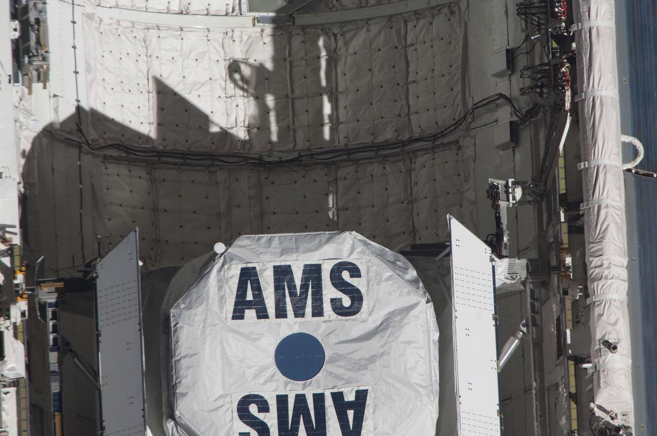 ISS027-E-032085 (18 May 2011) --- This close-up view of the Alpha Magnetic Spectrometer-2 (AMS) in space shuttle Endeavour’s payload bay was provided by an Expedition 27 crew member during a survey of the approaching STS-134 vehicle prior to docking with the International Space Station. As part of the survey and part of every mission's activities, Endeavour performed a back-flip for the rendezvous pitch maneuver (RPM). The station crew member used a digital still camera with an 800mm focal length, as the two spacecraft were approximately 600 feet (180 meters) apart.