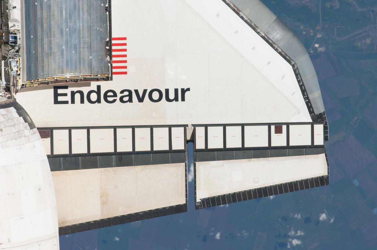 ISS027-E-032226 (18 May 2011) --- This partial view of the starboard wing of the space shuttle Endeavour was provided by an Expedition 27 crew member during a survey of the approaching STS-134 vehicle prior to docking with the International Space Station. As part of the survey and part of every mission's activities, Endeavour performed a back-flip for the rendezvous pitch maneuver (RPM). The image was photographed with a digital still camera, using a 400mm lens at a distance of about 600 feet (180 meters).