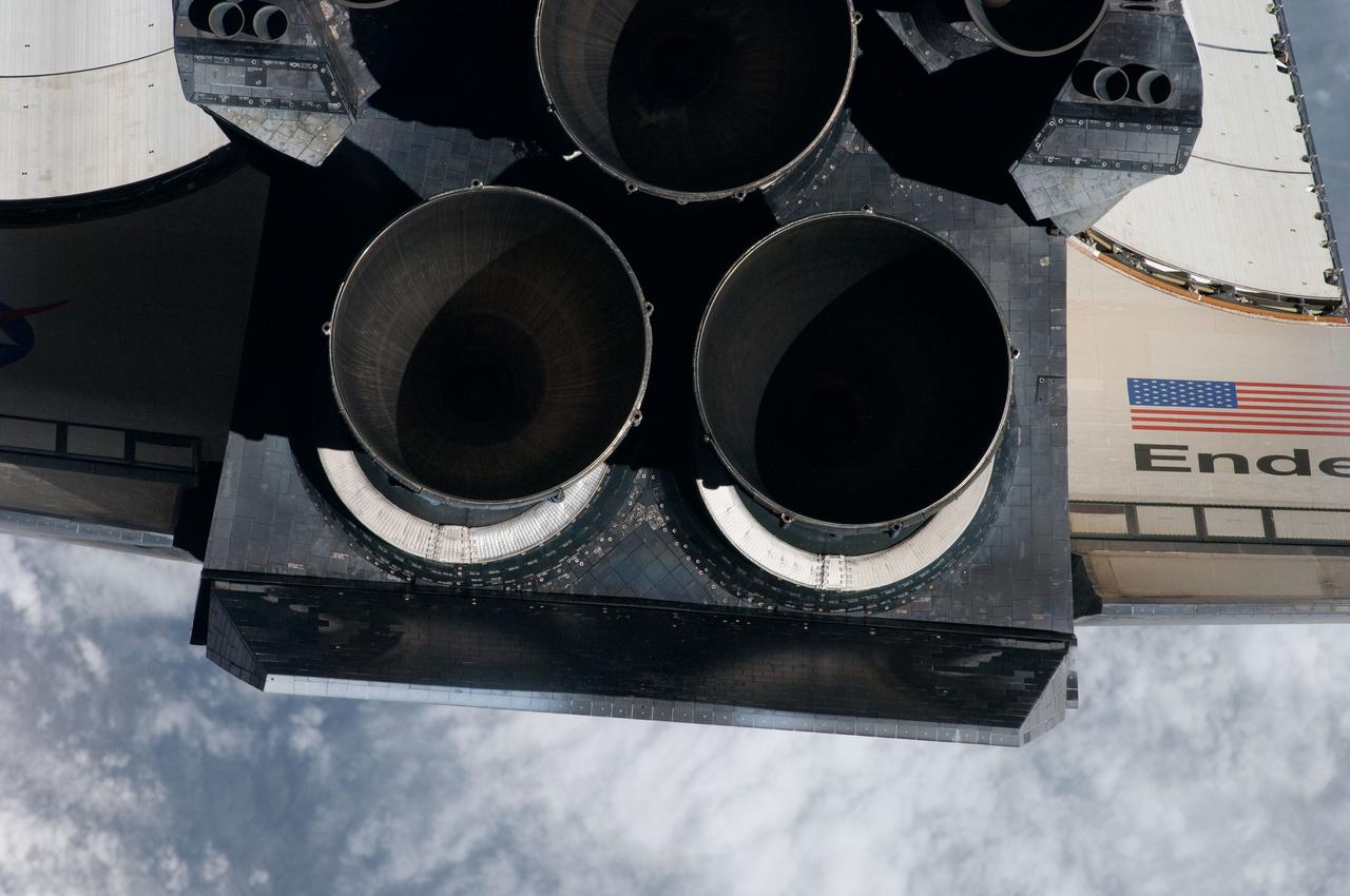 ISS027-E-032527 (18 May 2011) --- This view of the aft portion of the space shuttle Endeavour, including the three main engines and part of the wings, was provided by an Expedition 27 crew member during a survey of the approaching STS-134 vehicle prior to docking with the International Space Station. As part of the survey and part of every mission's activities, Endeavour performed a back-flip for the rendezvous pitch maneuver (RPM). The image was photographed with a digital still camera, using a 400mm lens at a distance of about 600 feet (180 meters).
