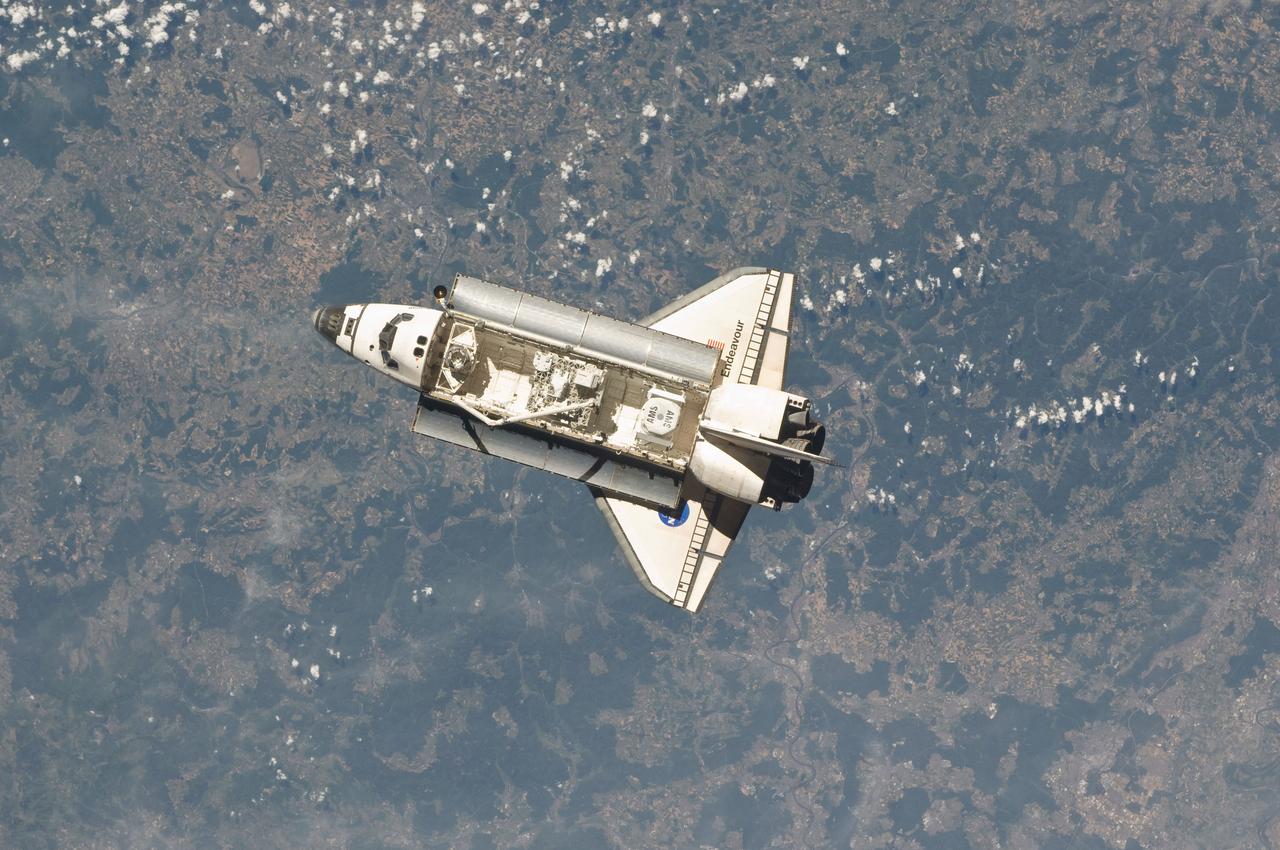 ISS027-E-032628 (18 May 2011) --- One of the Expedition 27 crew members aboard the International Space Station (ISS) recorded this image of the space shuttle Endeavour as the two spacecraft made their relative approach on May 18, 2011. Each spacecraft was occupied by six crew members until the STS-134 astronauts entered the ISS minutes after the docking.