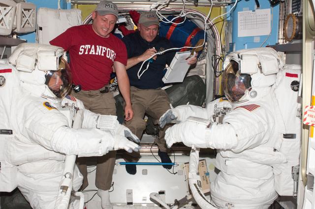 NASA image: Feustel, Chamitoff, Fincke and Kelly in A/L during EVA 1 Preparations