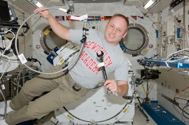 NASA image: Fincke conducts OGS Jumper Modification