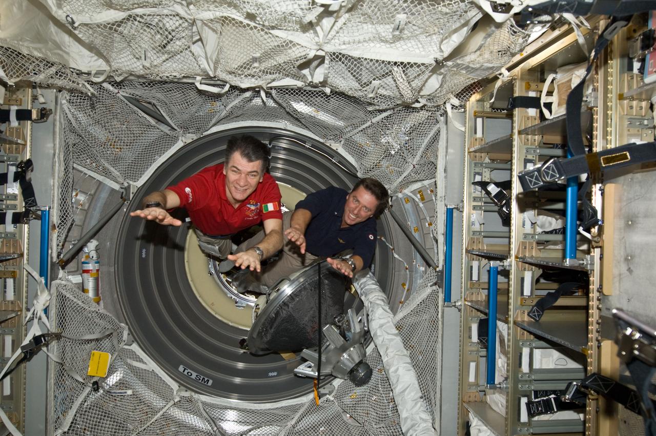 ISS027-E-036254 (23 May 2011) --- European Space Agency astronauts Paolo Nespoli (left), Expedition 27 flight engineer; and Roberto Vittori, STS-134 mission specialist, are pictured in the European Space Agency's "Johannes Kepler" Automated Transfer Vehicle-2 (ATV-2) currently docked to the International Space Station following an Earth-to-space phone tag-up with Italian President Giorgio Napolitano. Nespoli has been on the station for over five months and is due to return to Earth in less than 24 hours. Vittori is on a 16-day mission of the space shuttle Endeavour, joined by five NASA astronauts. This occasion is the second time two Italian astronauts have been in space together and the first time in the last 15 years.