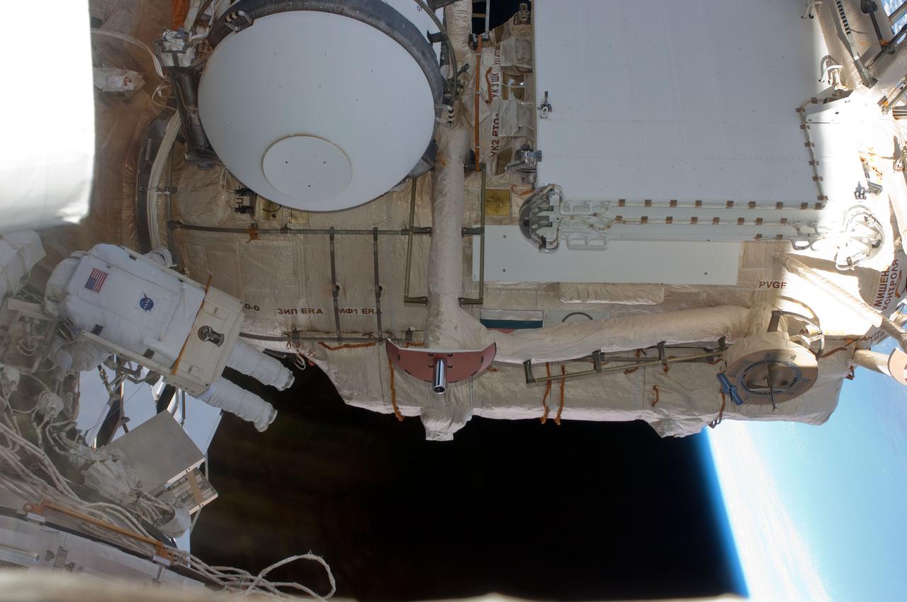 ISS028-E-005240 (25 May 2011)  --- With various components  of the International Space Station in the view, NASA astronaut Michael Fincke is pictured during the STS-134 mission?s  third  space walk. Astronauts Fincke and Andrew Feustel (out of frame), both mission specialists, coordinated their shared activity with NASA astronaut Greg Chamitoff (out of frame), who stayed in communication with the pair and with Mission Control Center in Houston from the shirt sleeve environment inside the ISS.