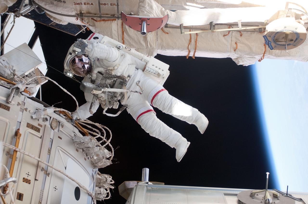 ISS028-E-005271 (25 May 2011)  -- With various components of the International Space Station in the view, NASA astronaut  Andrew Feustel  is pictured during the STS-134 mission?s third  space walk (and Feustel?s third, as well). Astronauts  Feustel and Michael Fincke (out of frame), both mission specialists, coordinated their shared activity with NASA astronaut Greg Chamitoff (out of frame), who stayed in communication with the pair and with Mission Control Center in Houston from the shirt sleeve environment inside the ISS.