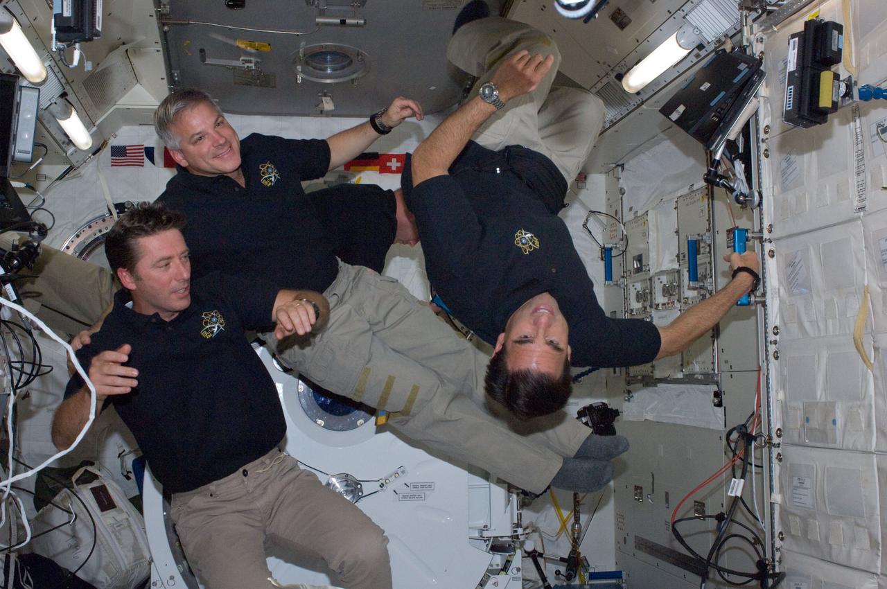 ISS028-E-005620 (26 May 2011) ---- Three members of the STS-134 crew assigned to space shuttle Endeavour?s final mission are pictured in the Japan Aerospace Exploration Agency?s Kibo lab on the International Space Station, where they joined with three other crew members (out of frame) for a crew portrait. Left to right are European Space Agency astronaut Roberto Vittori and NASA astronauts Greg H. Johnson and Greg Chamitoff. Johnson is the mission's pilot and the other two are mission specialists.