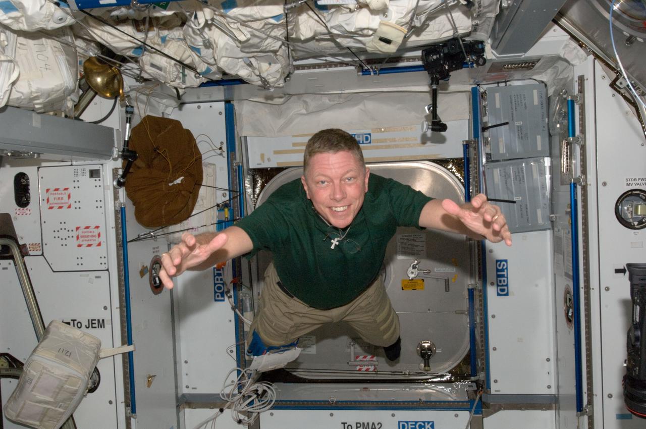 ISS028-E-007695 (12 June 2011) --- NASA astronaut Mike Fossum, Expedition 28 flight engineer, is pictured floating freely in the Harmony node of the International Space Station.