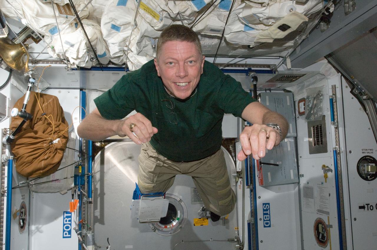 ISS028-E-007701 (12 June 2011) --- NASA astronaut Mike Fossum, Expedition 28 flight engineer, is pictured floating freely in the Harmony node of the International Space Station.