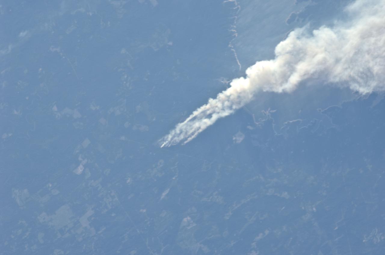 ISS028-E-008373 (21 June 2011) --- One of the Expedition 28 crew members aboard the International Space Station, flying at an altitude of approximately 235 statute miles, on June 21 spotted and photographed this image of one of the  major Texas wildfires currently burning up massive acreage.  This one is near Jasper and Lake Sam Rayburn in far east Texas.